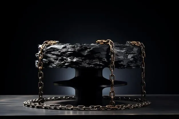 A stylish black faux leather shoulder bag featuring a prominent, chunky gold chain strap and heavy metallic hardware, placed on a dark, textured surface, highlighting its luxurious details.