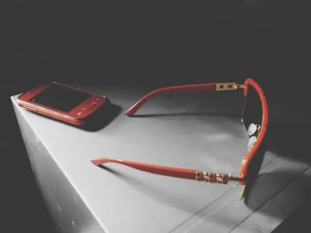 A stylish pair of semi-transparent, fashionable eyeglasses resting on a book, showcasing their design and appeal as a modern accessory.