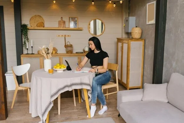 A brightly lit small living room with a SHEIN Home multi-functional coffee table that transforms into a dining table, surrounded by compact, modern seating.