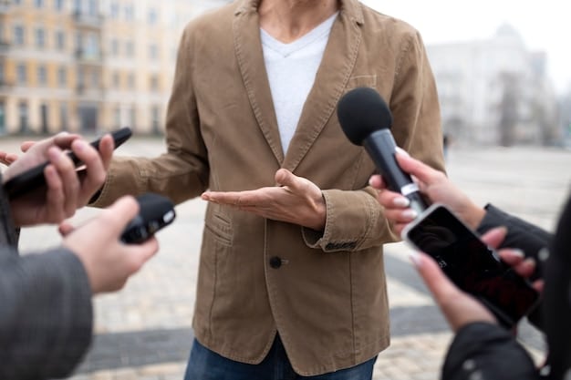 A close-up shot of a microphone being held during a community meeting, with blurred faces in the background, symbolizing the power of community voices in action. Focus on the details of the microphone and the atmosphere of engagement in the meeting.