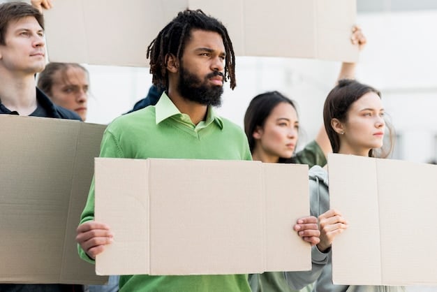 A group of community members participating in a peaceful protest, holding signs and chanting slogans to raise awareness about their cause. The image conveys a sense of passion, determination, and solidarity.