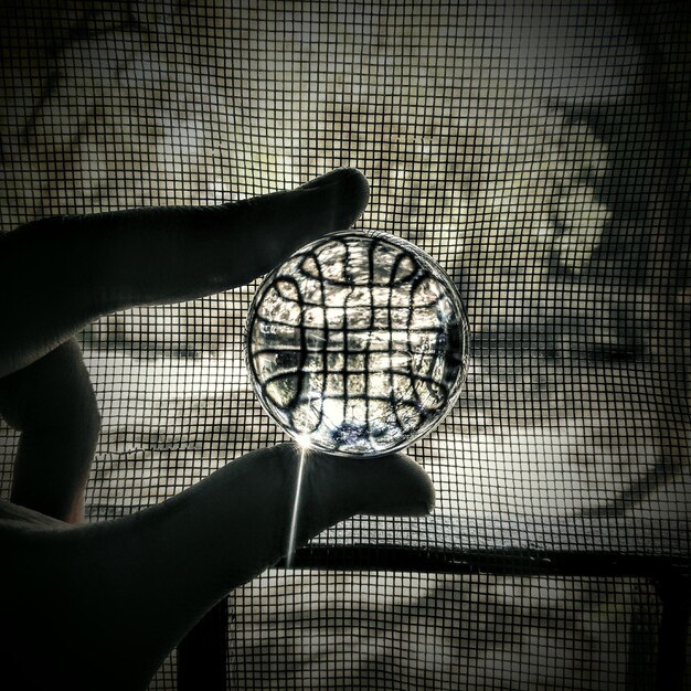A conceptual image representing a network security audit, featuring a magnifying glass examining lines of code and network diagrams, with symbols of firewalls, antivirus software, and intrusion detection systems in the background.