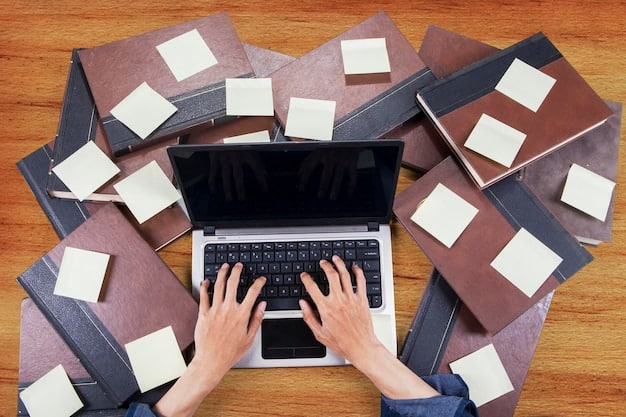 A close-up shot of a person researching grants on a laptop, surrounded by stacks of documents and application forms. The screen displays a grant application website for arts organizations.