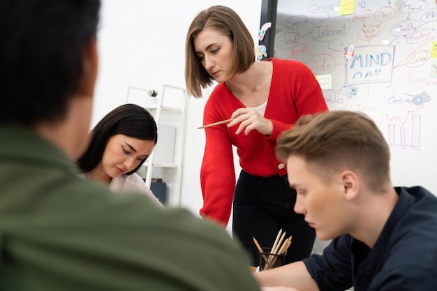 A teacher giving instructions to a small group of students working collaboratively on a project. The scene should emphasize active learning and problem-solving. The classroom is brightly lit and filled with student work.