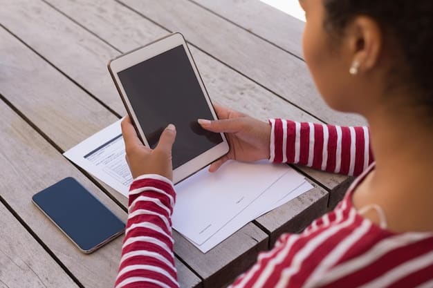 A close-up of a student working on a tablet during a test. The tablet displays an interactive question that requires the student to manipulate objects on the screen. The student is focused and engaged.