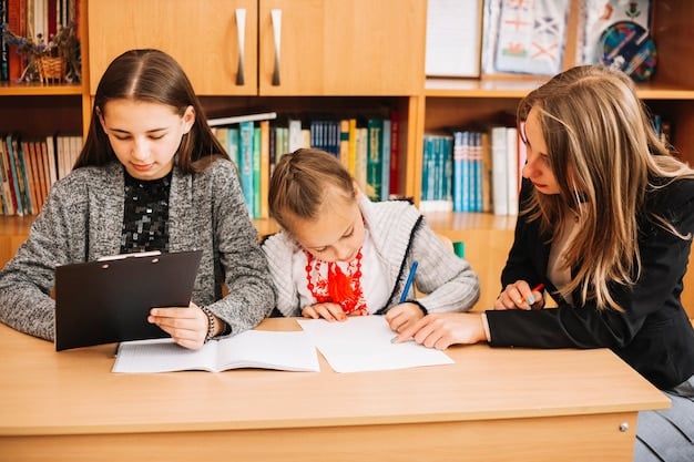 A parent and teacher sitting across from each other at a table, reviewing documents related to a student's IEP during a meeting.