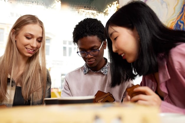 A group of diverse students sitting around a table, looking at a tablet device together. They are engaged and smiling. The setting is a modern, well-lit classroom, with technology integrated seamlessly into the learning environment.