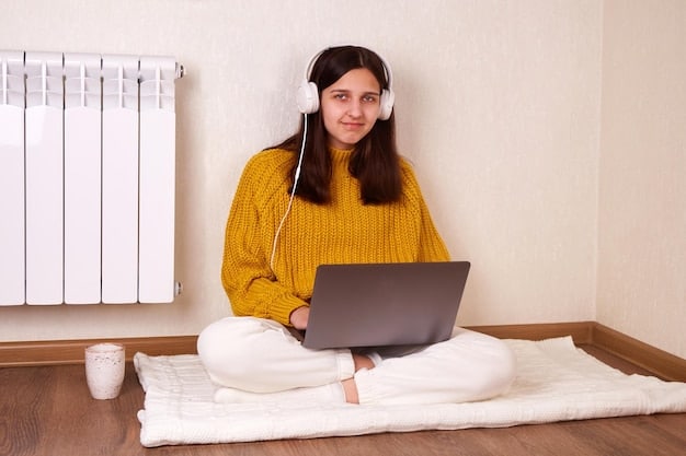 A teenage student is participating in a telehealth therapy session from her bedroom. She is sitting comfortably in front of her laptop, engaged in a conversation with a therapist on the screen. The setting is relaxed and private.