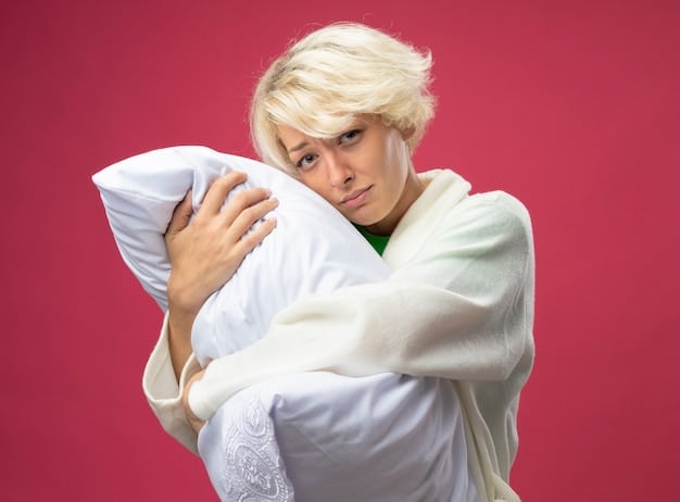 A person snuggled comfortably under a duvet, with only their head showing, implying deep, restful sleep