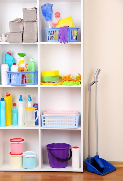 A neatly organized cleaning cabinet or utility closet, featuring various SHEIN storage containers and racks holding cleaning products, all appearing tidy and accessible.