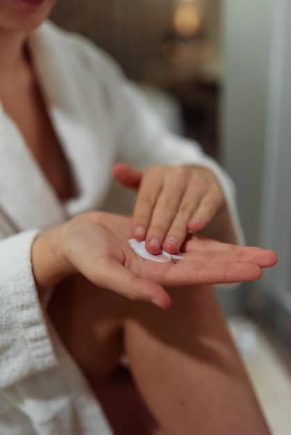 A close-up of a hand applying a light, transparent gel to a clean face, emphasizing gentle, non-comedogenic application.