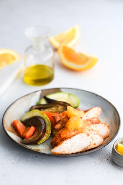 A close-up shot of a perfectly grilled salmon fillet garnished with dill and lemon wedges, alongside a small bowl of fresh blueberries, emphasizing healthy omega-3s and antioxidants.