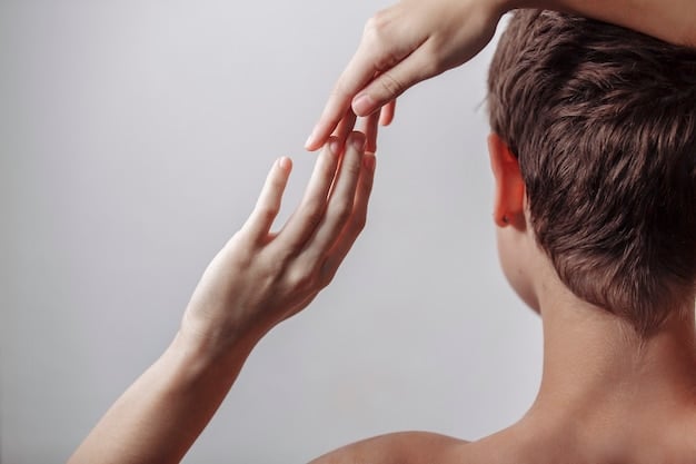 A close-up shot of a person's scalp being gently massaged with fingertips, emphasizing scalp health. The hair is slightly parted, revealing healthy skin underneath, with a soft, warm light indicating care and well-being.