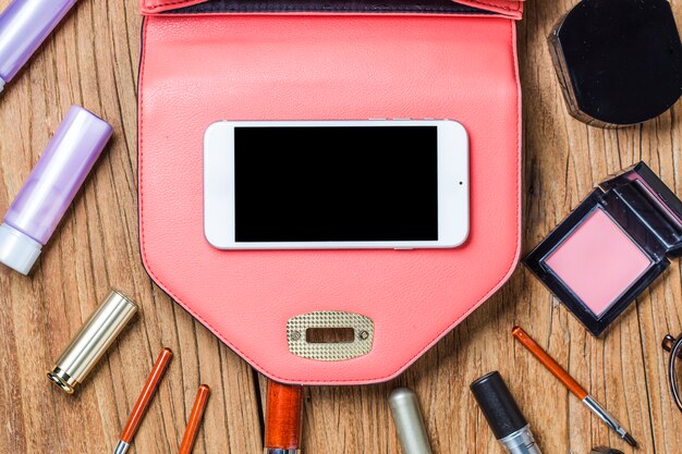 An open SHEIN crossbody bag, neatly organized with small clear pouches for makeup and tech, a slim cardholder, and a compact mirror, showing an efficient and clutter-free interior.
