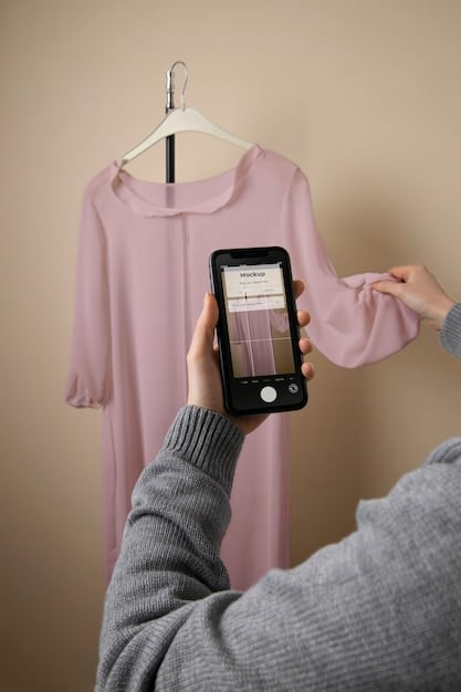 A person's hand holding a smartphone, displaying an online clothing store's size chart on the screen, indicating the convenience of digital tools for sizing. The background is blurred, focusing on the phone.