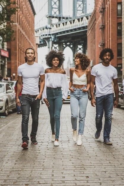 A diverse group of people confidently walking and interacting in comfortable, stylish, and well-fitting clothing, showcasing individual expression and ease of movement in everyday settings.