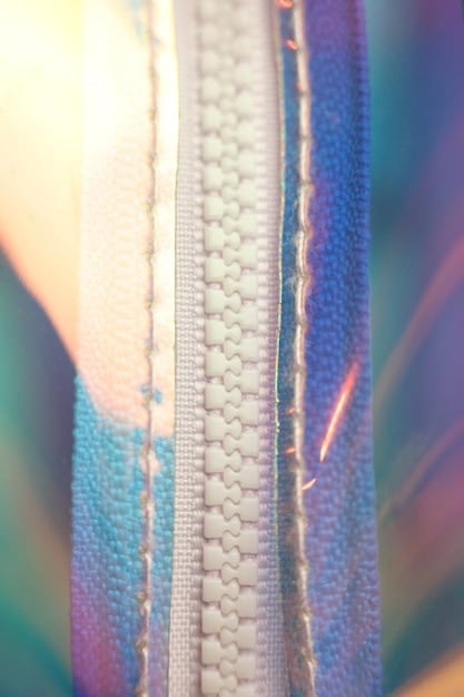 A close-up of a textile with integrated flexible circuits and small, glowing LED components, demonstrating smart fabric technology seamlessly woven into the material.