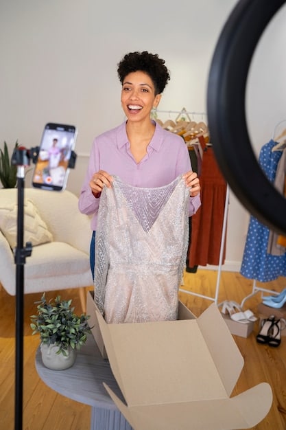 A close-up shot of a US fashion influencer unboxing a large SHEIN package filled with various clothing items and accessories, smiling joyfully, with soft studio lighting highlighting the textures of the fabrics.